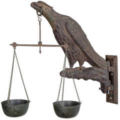 Cast Iron Wall Mount in an Eagle Form Holding Balance Scales, Mid-19th Century