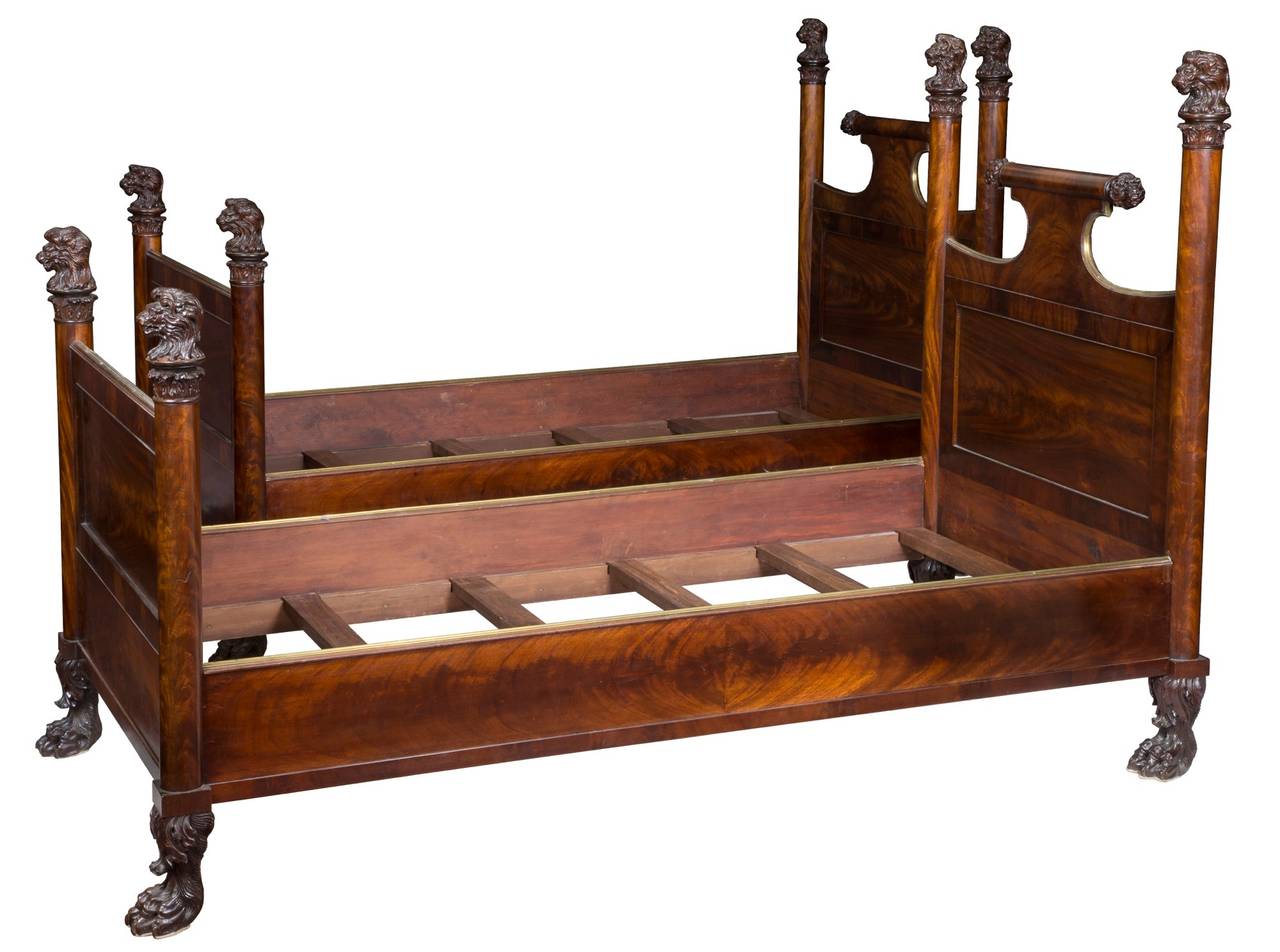 A fine pair of Regency/classical figured mahogany beds with carved lions and paw feet, England, circa 1820.

Twin beds of quality are hard to come by and this pair is exceptional. With the finest figured mahogany throughout, and of the best