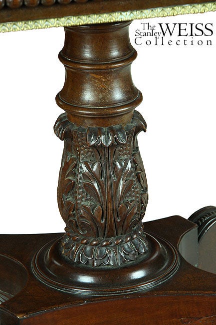 This top-rank card table has leaves of solid Santo Domingo mahogany above an apron of decorative balls above a brass edge trim. The level of detail is extremely fine and is followed throughout the rest of this table’s construction. The central