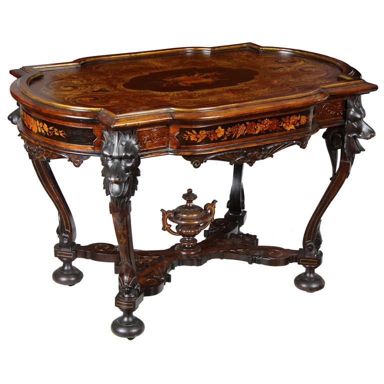 Rare Walnut Inlaid Center Table with Dramatic Wolf Heads
