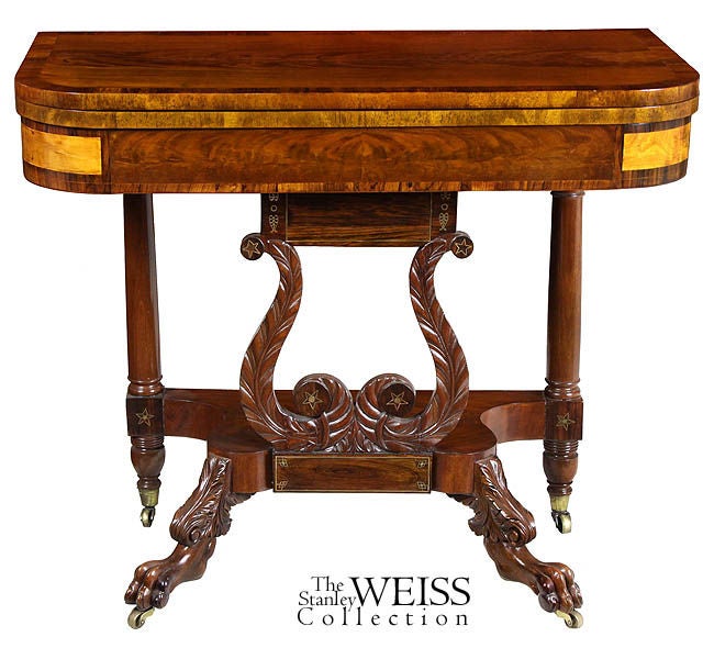 This form is particularly interesting because it shows a transition from card table form toward pier table design and is unique to this neoclassical period. This design configuration was used in other forms, i.e. the Lyre supports of a worktable