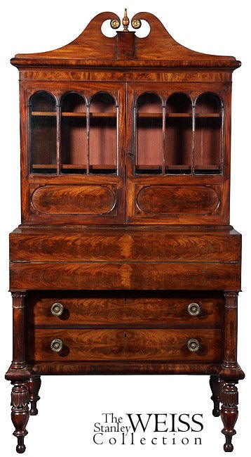 This is an interesting secretaire retaining its original first surface, which over the years has turned a warm golden color and patina. Although, at first glance, one might consider this an Empire secretaire, it has many elements of earlier and