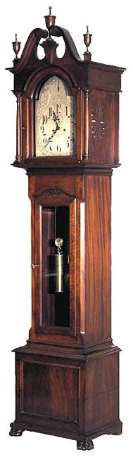 This clock is in original condition including its large finials.  The silver dial is fully engraved, and quite desirable, as they hearken back to an early eighteenth century silver dial.  The silvered dial is over a brass faceplate and the movement