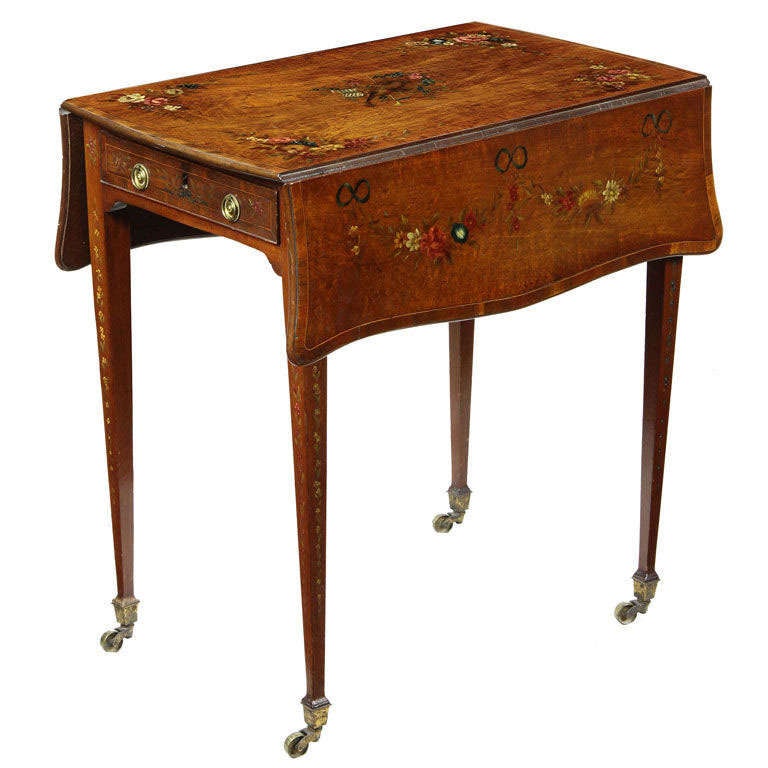 This is a small-scale pembroke table in superb condition, which over the years has mellowed to an amber satinwood color. Note the beautiful choice of woods with inlaid mahogany crossbanding and floral or musical motifs. This pembroke table came to