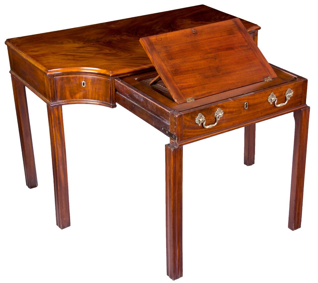 This table has a solid mahogany top of magnificent swirled figuring. While closed, it can certainly function as a server, console table, or library table. The neat feature of this piece is that the front pulls out and has a well defined writing