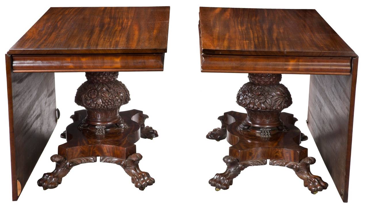 This is a large-scale table, which can be used in a variety of forms, circa 1830. Together, it makes a large-scale pedestal dining table; apart, the two component table can function as square tables either alone or together, or as matched pair of