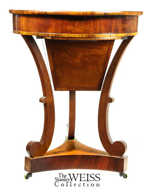 This work table or sewing table, without the wooden bag, would have certainly been called a center table. As a work table, is a fairly rare form. This table is in superb condition with beautifully figured mahogany throughout (see top enlargement).