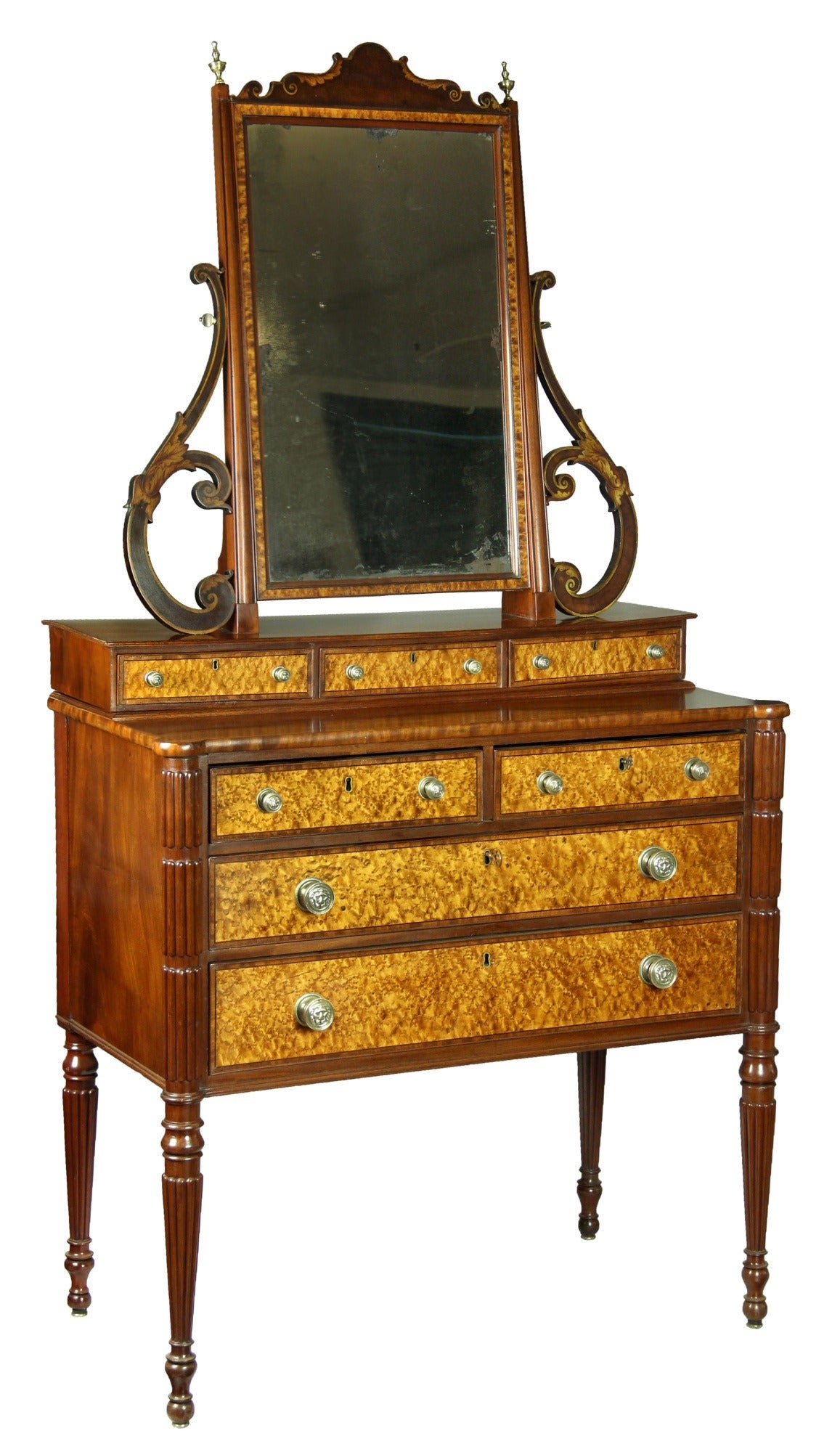 This is a very fine and desirable dressing table by, probably the finest cabinetmaker in Boston, one of the legends of Federal furniture. A very closely related example is at the MFA, and illustrated in American Furniture in the Museum of Fine Arts,