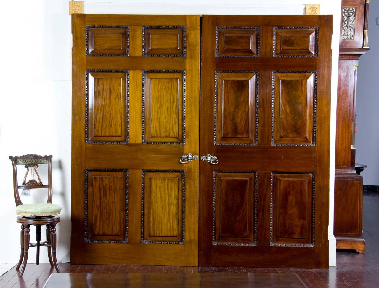 This is a pair of large and very heavy doors which are paneled on both sides. They are 2 ¼ in. thick and require two men to lift and move. These doors are crafted like furniture and are through-tenoned (see detail) literally to last for life. The