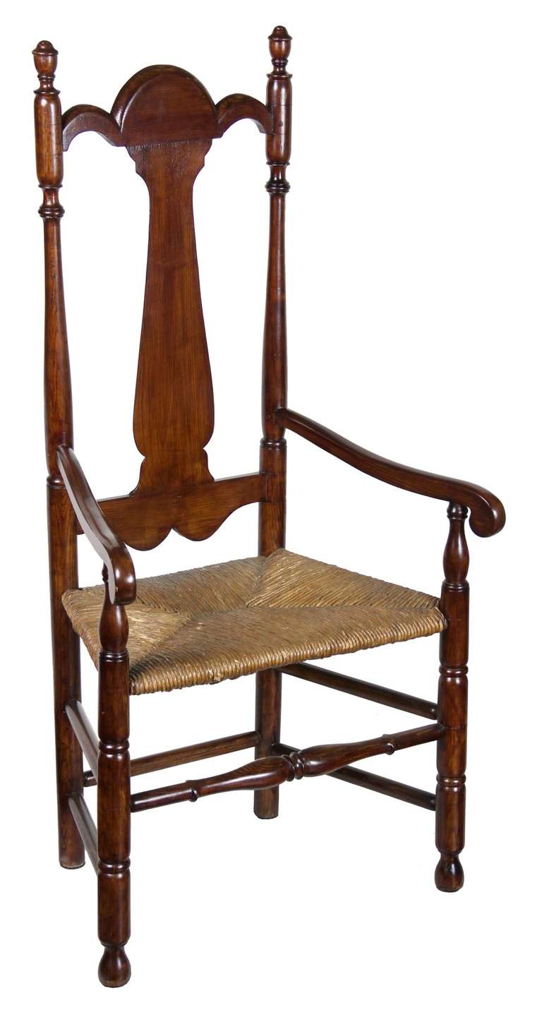 This stately chair has a very tall back, with beautifully sculpted splat that integrates nicely into the splat rail. The height of this chair gives it a commanding presence and its nicely sized seat is graciously inviting. Included below are images