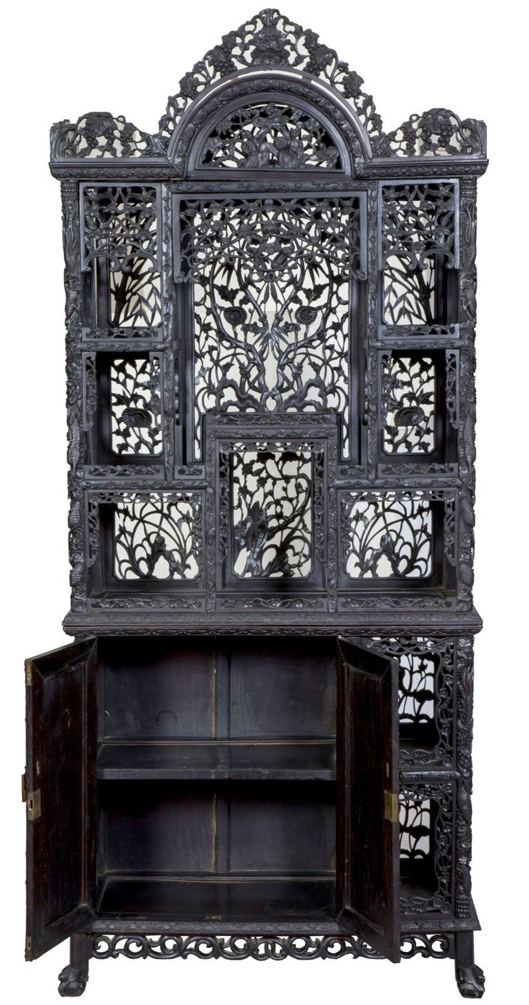 This is clearly one of the finest of its type we have handled. While it is a large piece with separate upper and lower sections, it is quite airy and open, given the magnificent open carving throughout. Please take a moment to study the details.