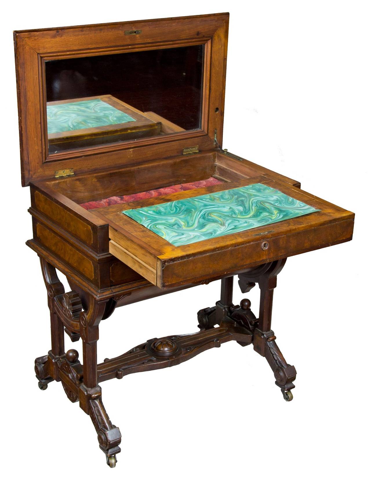 It is rare enough to find pieces such as this with their original label in place and rarer still to find them also with a first surface. This worktable/sewing cabinet is a tour de force with a mirror under a marquetry lid with pull-out writing