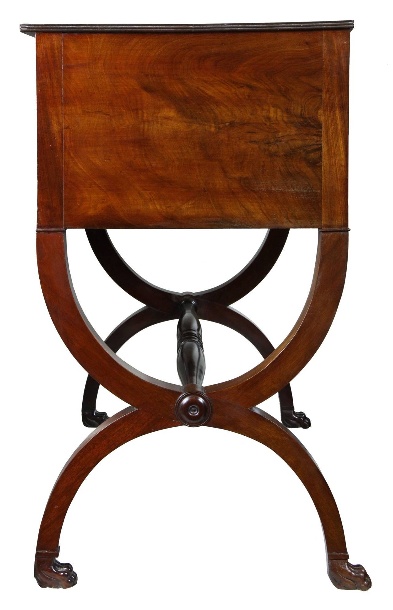 These small case pieces circa 1810 can be used either as a dressing table in a bedroom or a small server in a dining room. The Curule base is highly desirable, harkening back to Grecian Classical form. The mahogany is highly figured and has