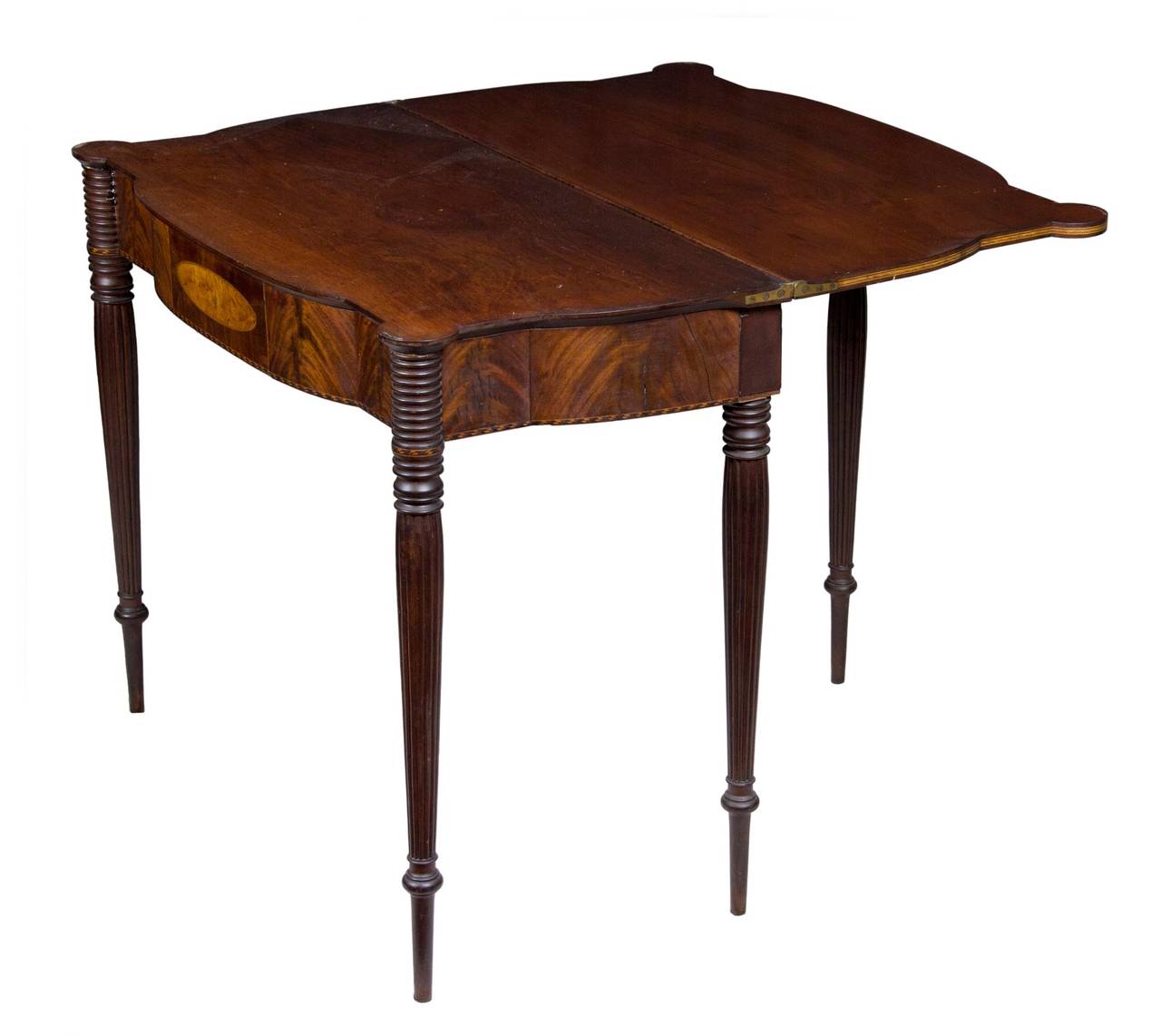 This table relates to a grouping of Portsmouth furniture as described in Brock Jobe’s seminal book on that subject. The form is very elegant, and this table is certainly a lady, with the first turning almost 6 inches off the ground, as if to say,