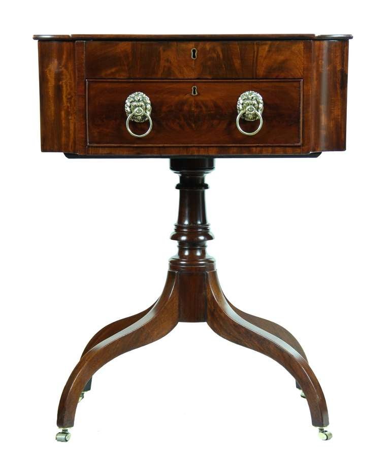 This is an exceptional work table of beautiful form. We have never seen the convex corner so well executed, which reduces the mass of the form. With, basically, a lift-top and drawer, it has a lightness of feel. Note the lift top, it is a solid