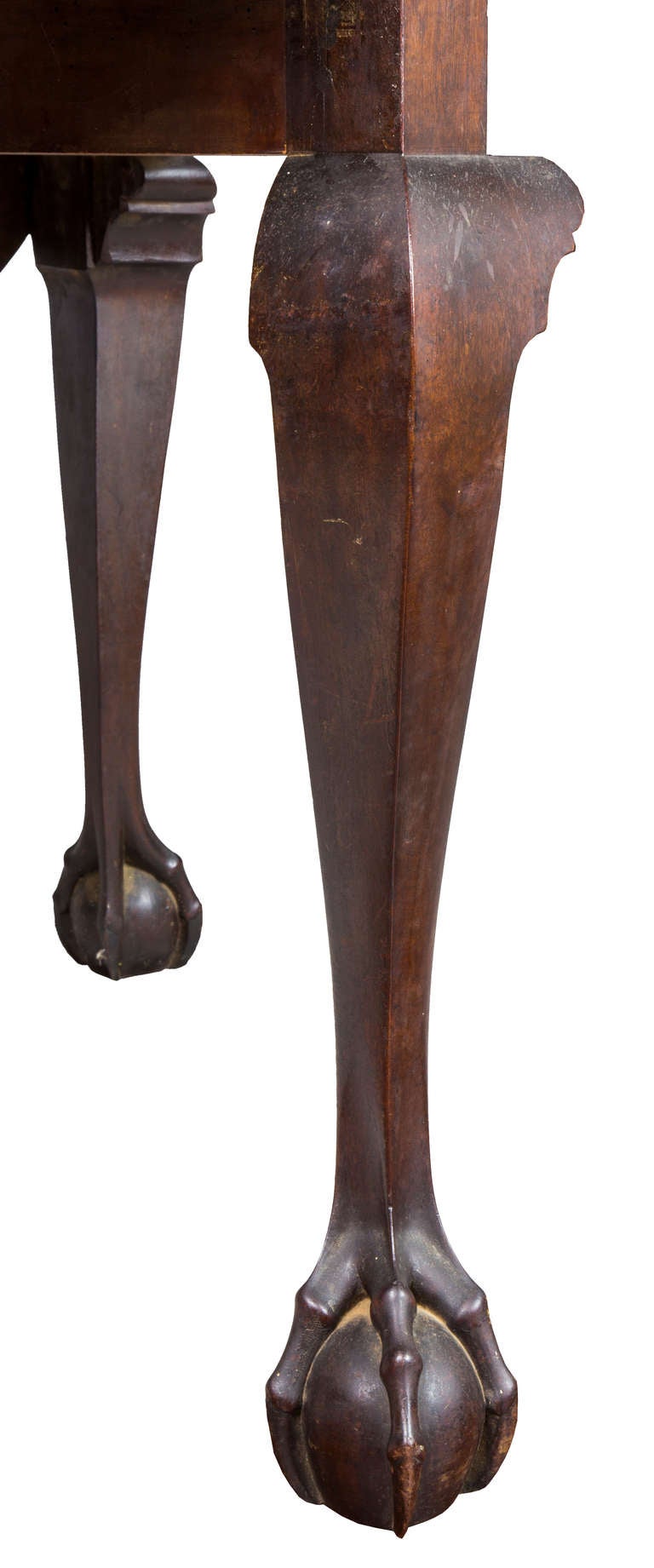 This table has a reshaped top. It probably had long, square leaves. Like the Venus de Milo, we can’t see throwing it in the wood pile because what is there is the best part of an altered masterpiece, its carved legs with claw and ball feet which is