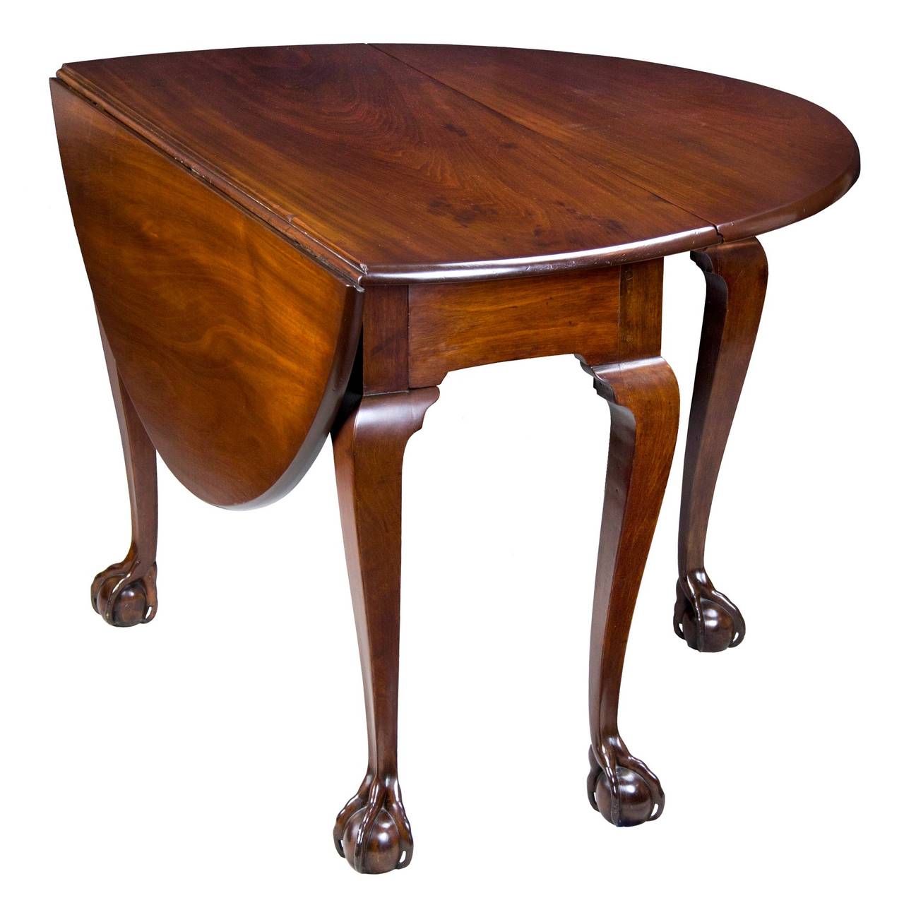 This table has been reduced in size. All parts are original, but at some point the frame was reduced and the top reshaped, making it a small, very handsome table, circa 1765. We don’t usually handle pieces that have been altered to this extent,