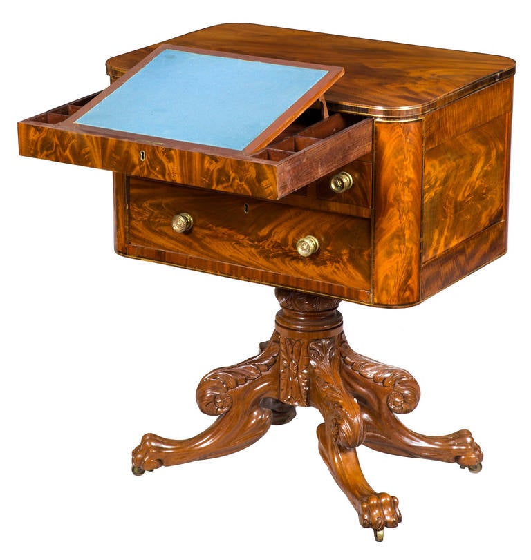 This table is labeled twice by a stencil in each of the two main drawers. It is composed of highly figured mahogany embellished with a double brass line inlay around the top edge as well as the bottom of the casepiece proper and end panels. The