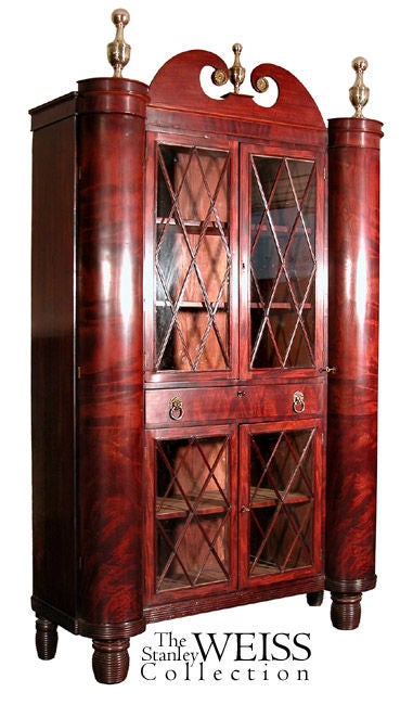 This is an important example of Baltimore Classical furniture at its finest. It makes a profound architectural statement with two highly figured cylinders resting on reeded beehive feet indicative of Baltimore and the work of needles and others. The