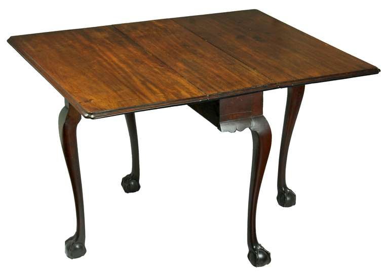 This drop leaf table, which is 34 ½ wide, is only 10 deep when the leaves are closed, making it a very serviceable  table that would take little space.  This form also called a Sunderland table, is related in style to a mid 19th century table
