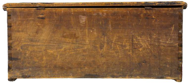 This sea chest has an asymmetric form which obviously was made to fit within the confines of a ship. This chest is all original and has had no alterations or modifications. There is some loss to the pigment of the stencilled eagle. This chest came