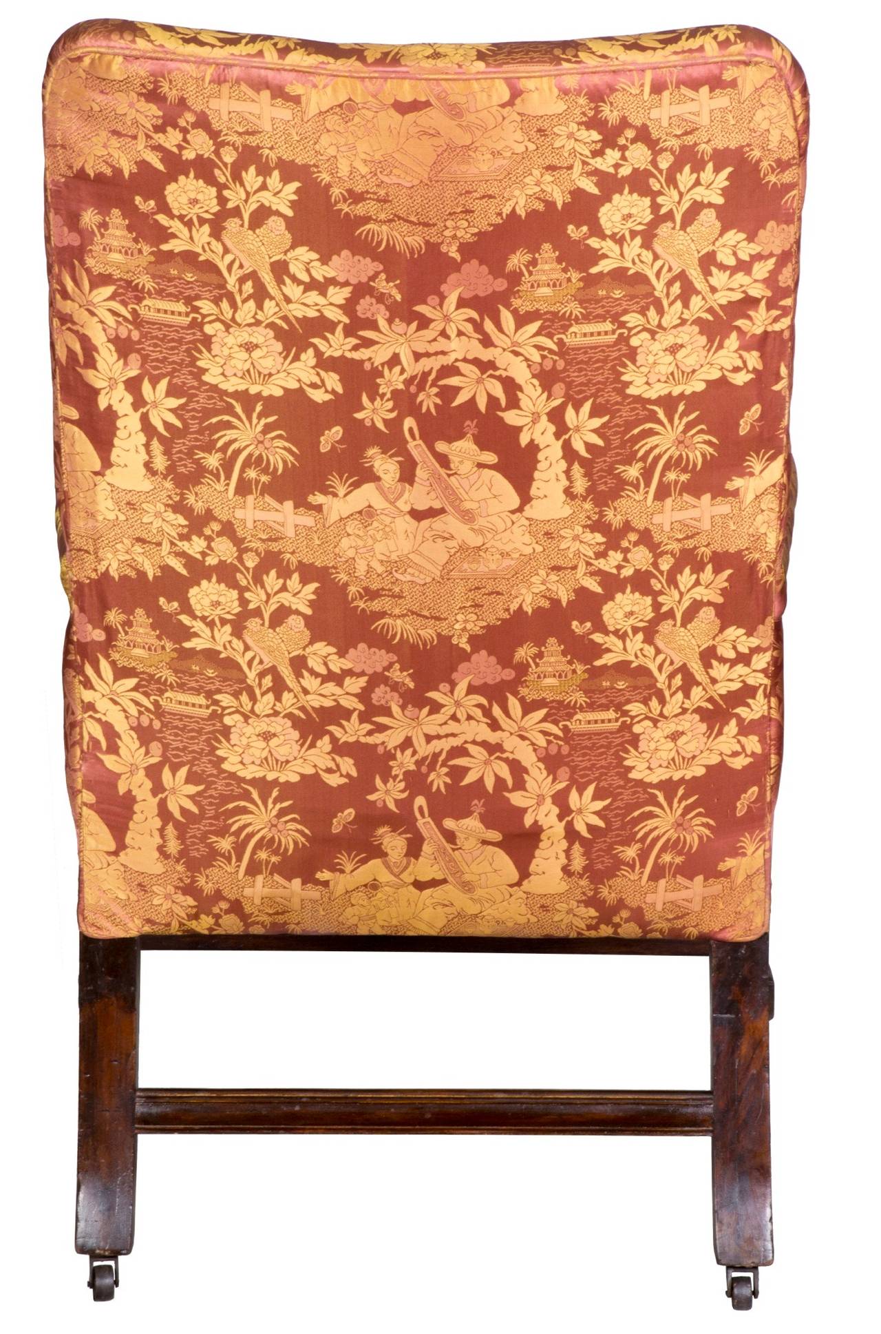 This is a good sized chair which is as comfortable as it looks. The arm supports are beautifully carved and detailed, as are the legs. The casters in the rear were added later--and the Marlboro foot at the bottom of the leg raised accordingly--all