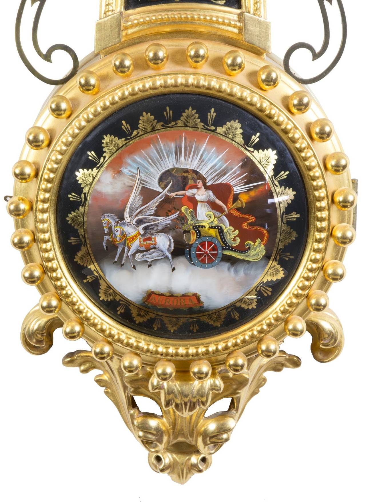 Elmer Stennes is no more, but his clocks are a legend, some of which were constructed in prison while serving a murder sentence. The gilding on this clock is highly burnished and of the very best, as is the carving. The reverse painting and the case