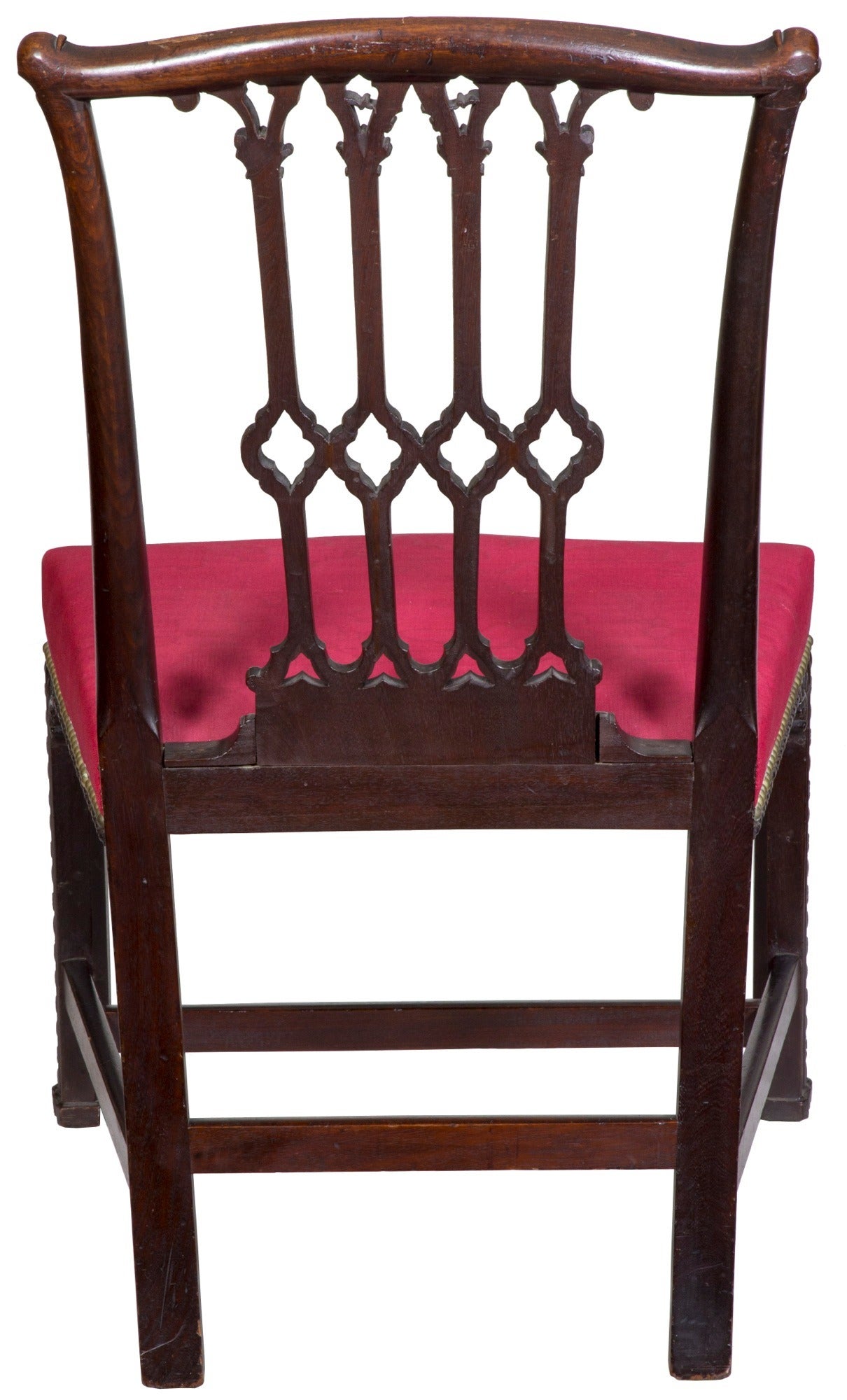 This is a chair of good size with bowed seat and superb carving throughout. It’s of good weight, of the best dark, heavy mahogany, which is fully carved. Note the carving on the front legs with the Marlboro cuffed feet. The stiles are fluted and the