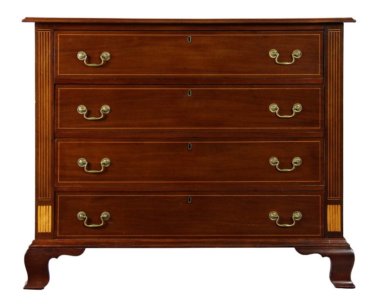 This is an exceptional bureau. Note the beautifully carved bracket feet, which are quintessential Newport. Note the bookend satinwood inlay just above the leg, again, a Newport trait. For another example of this attribute, see the Newport demilune
