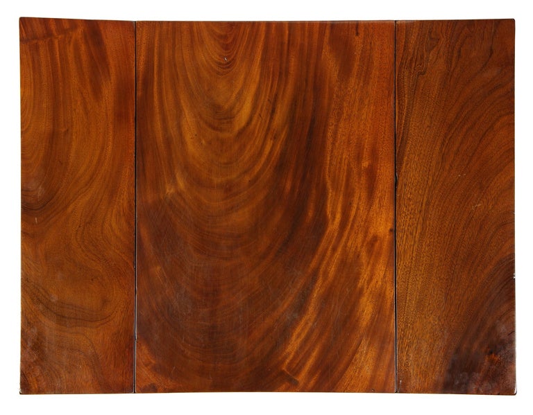 Generally, Connecticut pembroke tables are composed of cherry, as mahogany was imported and very expensive. The mahogany used in this card table is truly magnificent (see the top). This is the finest ribbon grain dense mahogany used during the