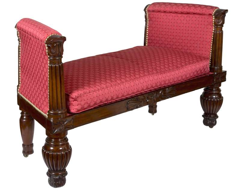 Window seats are quite rare and of course, can serve other functions as well, as this is small-scale, although monumental in its appearance. The reeded legs support carved panels with reeded columns and carved embellishment above. For this later