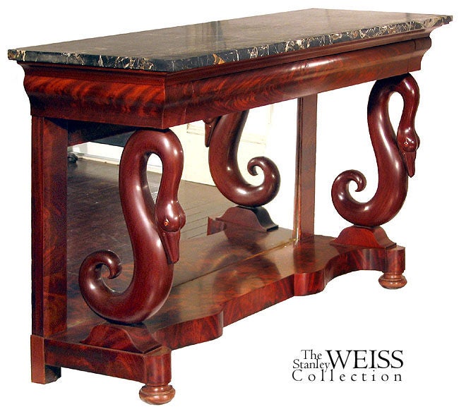 This large scale pier table-which can also be used as a serving table because of its width and large drawer under the marble top-is developed along highly decorative swans which serve as the front support columns. Note some of the close-ups and the