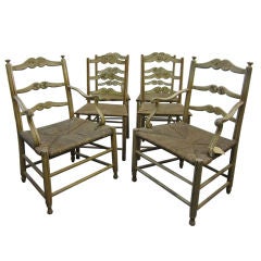 A Set of Six Rush Seated Painted Chairs