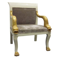 An Egyptian Revival Gilded Dolphin Chair