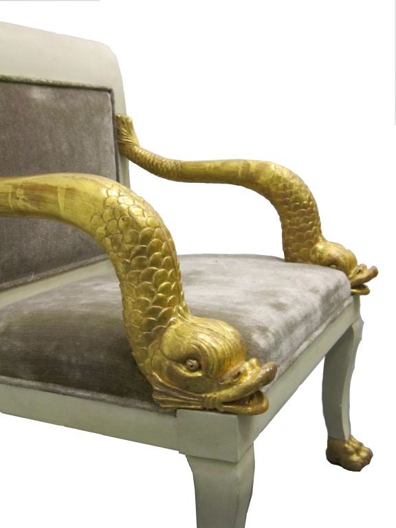An Egyptian Revival Gilded Dolphin Chair