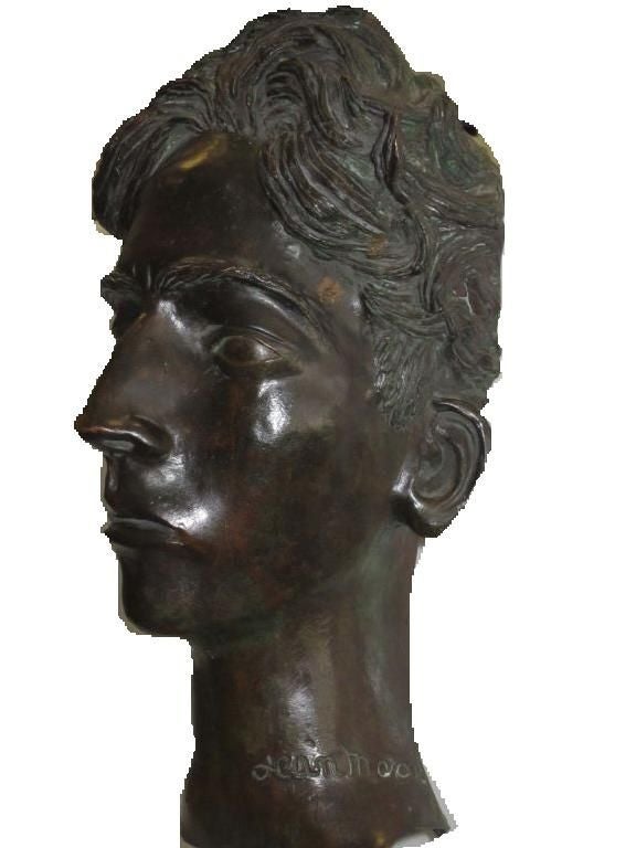 A portrait bronze bust of Jean Cocteau (1889-1963) by Jean Marais (1914-1998). Signed on the base.