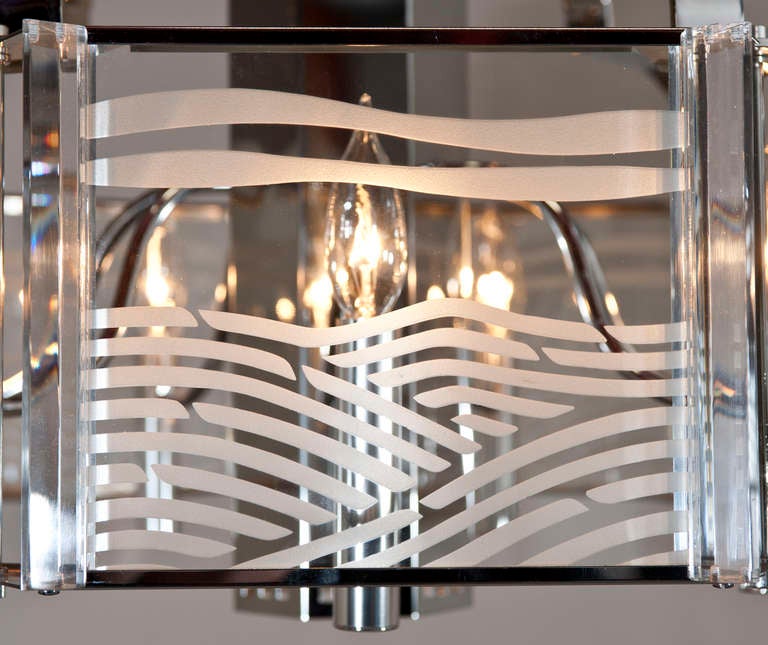 Good scale chrome and etched glass chandelier with 7 sockets and 1 in the middle pointing down that works with a switch on the fixture itself. This seven sided chrome chandelier with etched glass inserts held in place by lucite strips. Cleaned and