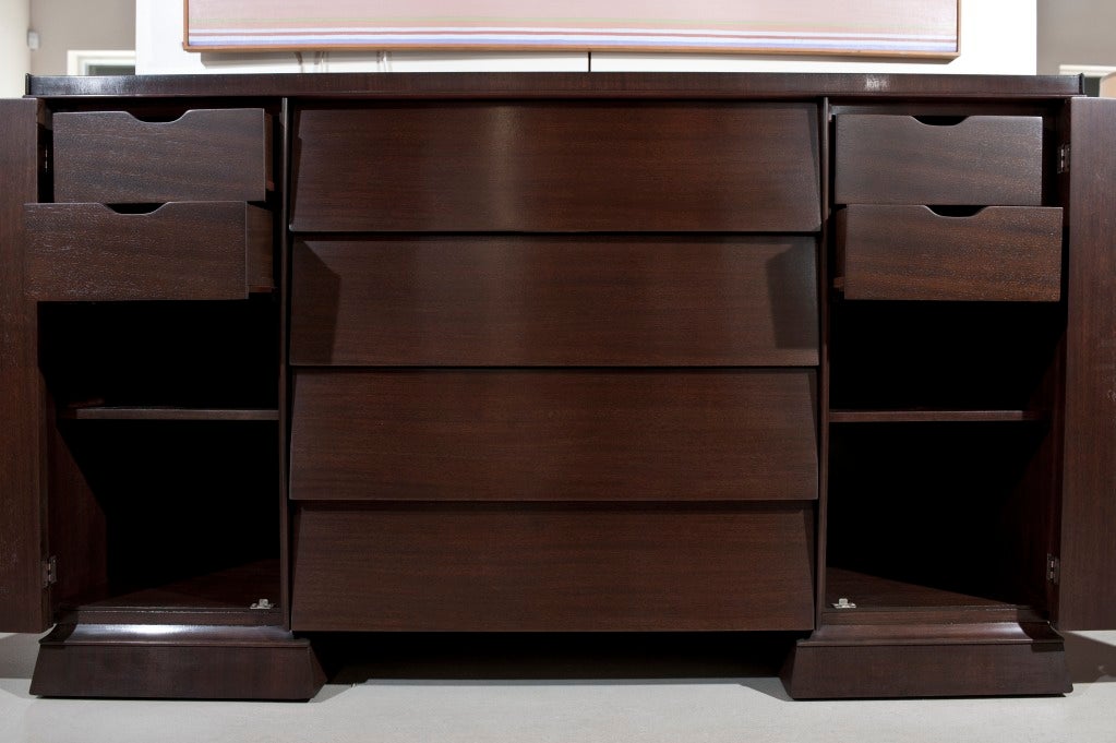 Walnut cabinet in unique design with 4 shutter like drawers and 2 doors with chinoiserie detail. Handle under each drawer. Beautifully fitted inside . Refinished and hand rubbed.