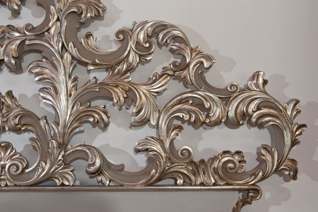 Hand carved wooden headboard with amazing detailed pierce work. Gesso and silver leaf with taupe lacquer.