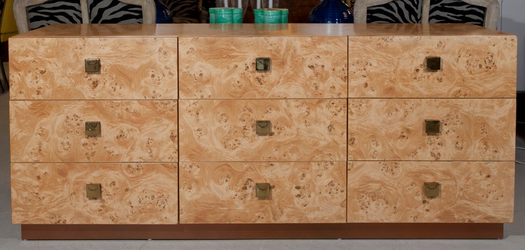 Burl olive 9 drawer credenza/long chest of drawers. Original design brass pulls.