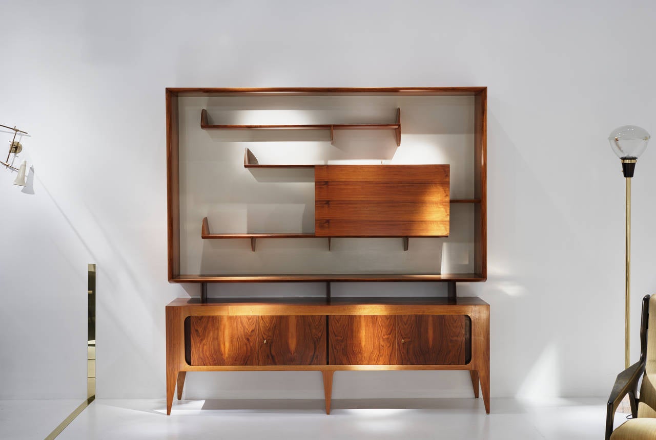 Gio Ponti,
cabinet,
Italy, 1951.
Manufactured by Singer & Sons.
Walnut veneer.
Dimension: 80 H x 18 D x 78.75 W inches.