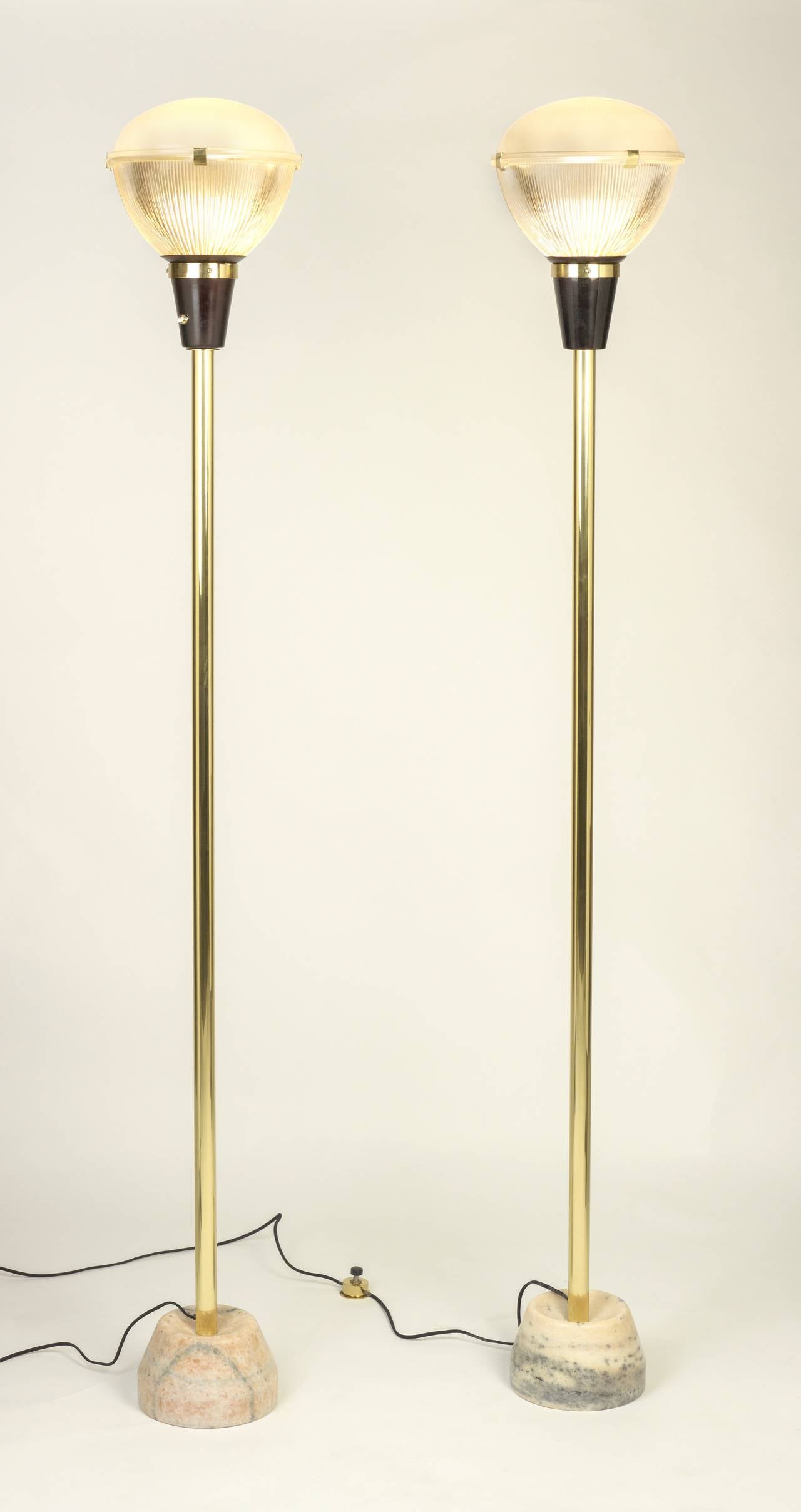 Ignazio Gardella.
Floor lamps model lte7, can be sold as pair or separately. 
Coppa Chiusa,
Italy, 1955.
Manufactured by Azucena.
Brass, marble, glass.
Measures: 70 H x 13 D inches.