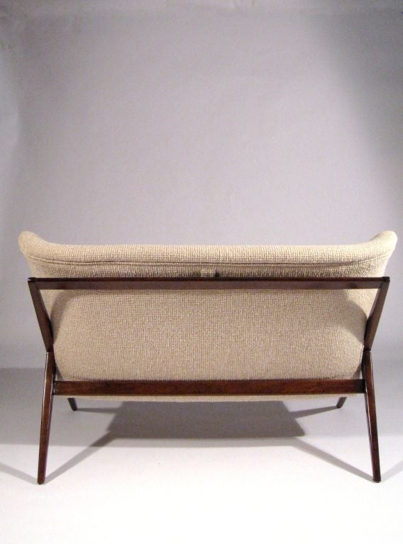 Franco Albini<br />
settee, model #147<br />
Singer & Sons<br />
Italy, c. 1950<br />
Italian walnut, upholstery<br />
52 w x 32 d x 35 h inches<br />
<br />
Literature: Singer & Sons manufacturer's catalog, c. 1950