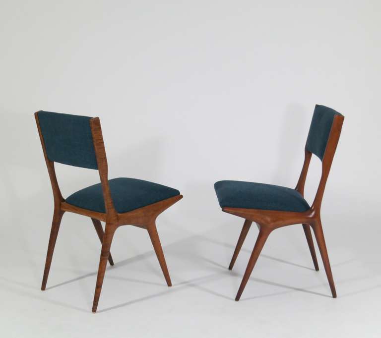 Carlo de Carli

Dinning Chairs, available in set of 12

Italy, 1953-1954

Manufactured by Cassina

Dsitrubuted by Signer & Sons as Model 158

Italian walnut, upholstered, brass feet

17 w x 21.5 d x 33.5 h inches