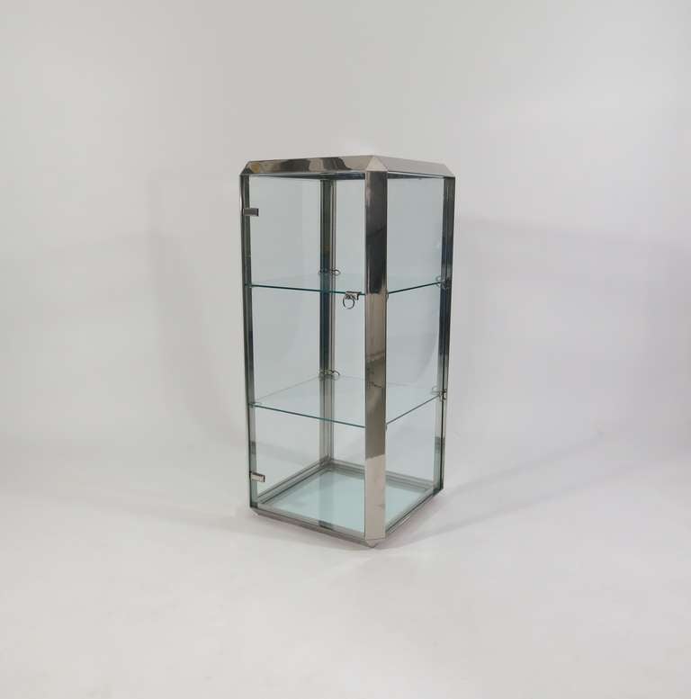 Vittorio Introini, Glass Cabinet, Italy, circa 1970.<br />
Manufactured by Saporiti, glass and polished stainless steel.<br />
22 w x 22 d x 47 h inches