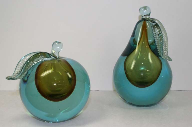 Really nice pair of beautiful glass fruits. Both are cut so they can be decorative and used as bookends.