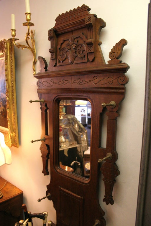 Victorian oak and marble hall tree with mirror inset.
