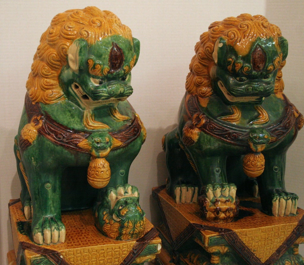 Chinese Pair of Ceramic Foo Dogs For Sale