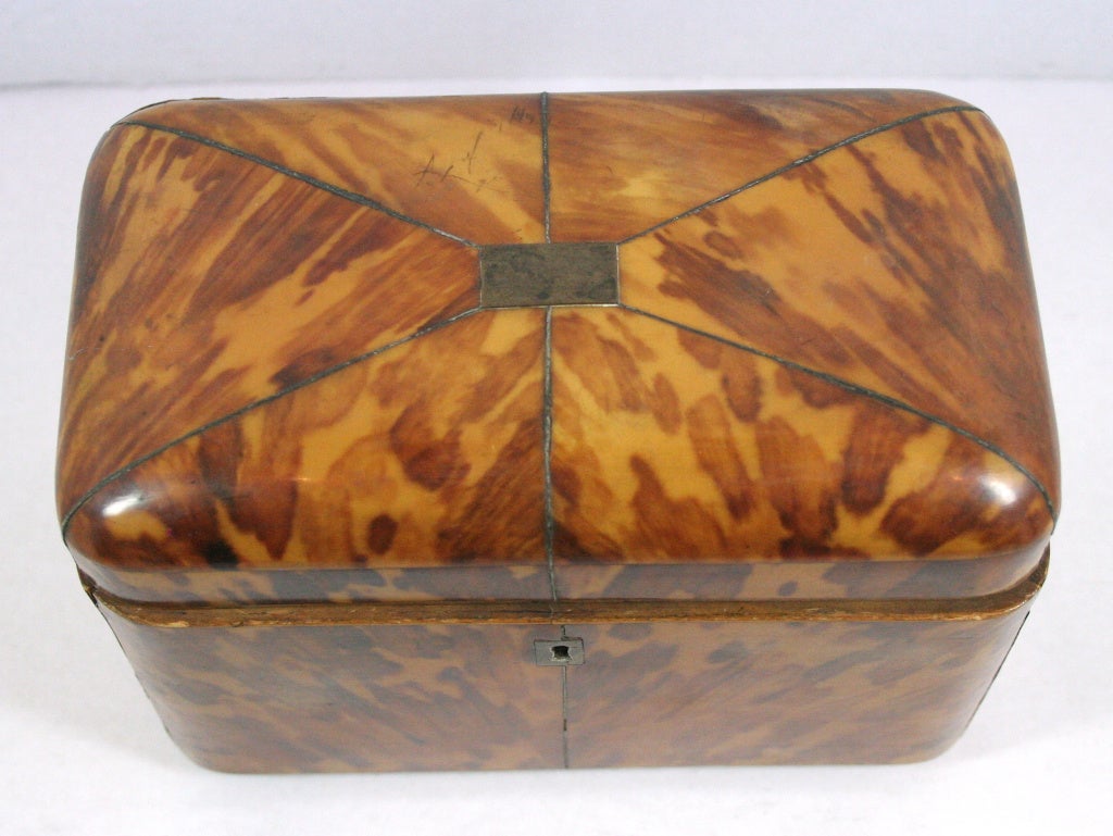 Very beautiful English regency tortoiseshell tea caddy in a wonderful light color. All original and very desirable.