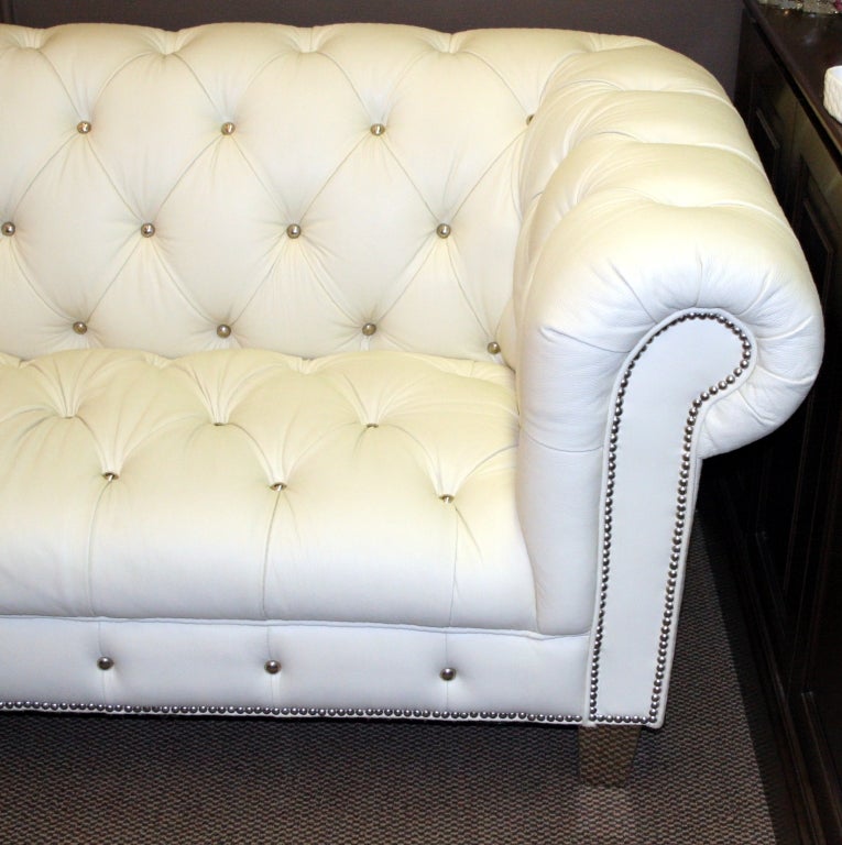 white tufted leather sofa